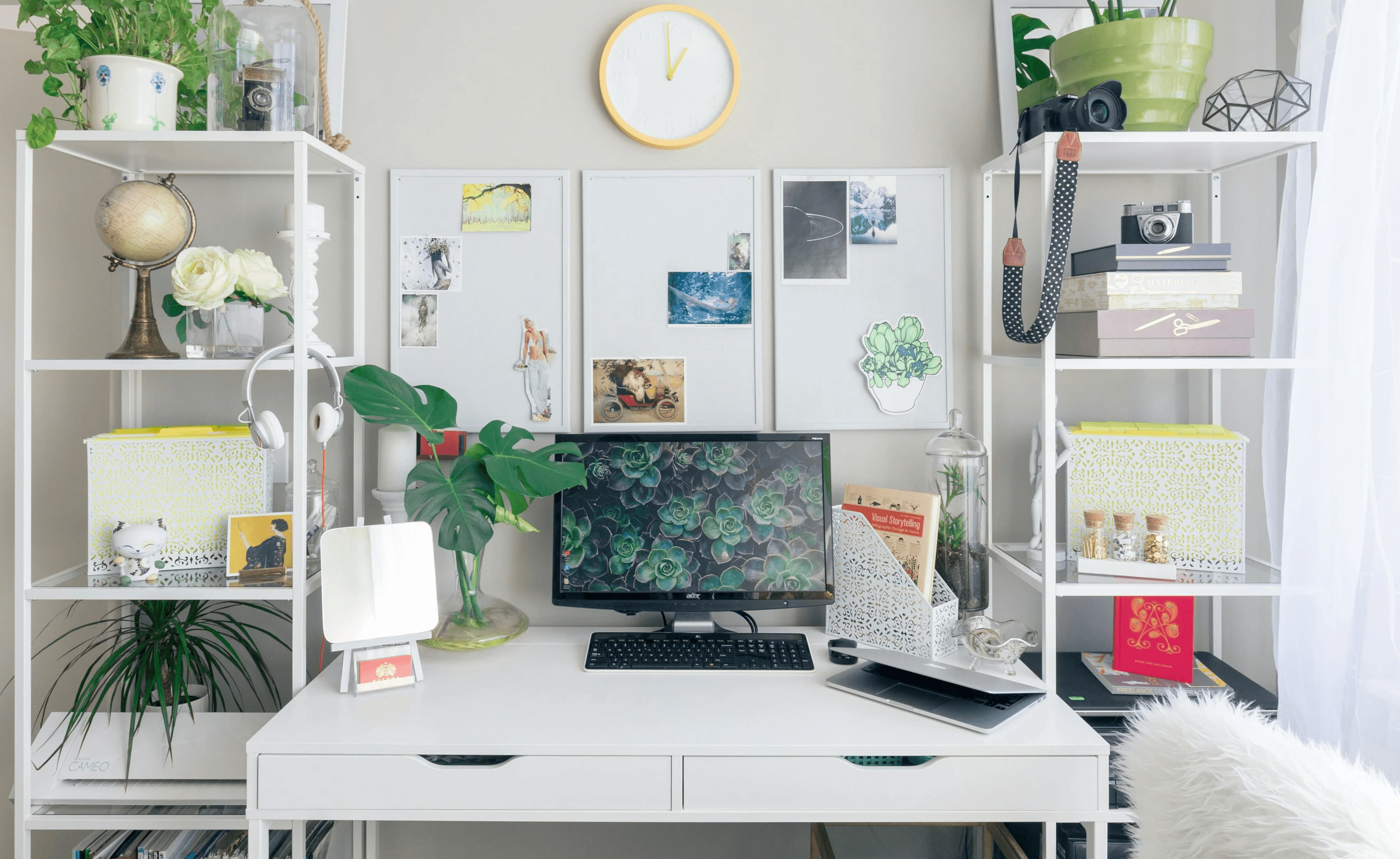 My modern workspace setup with a flat screen monitor on a clean white wooden desk
